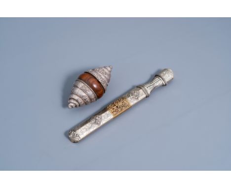 Full title: A silver-mounted wooden conch shell-shaped box and a mixed metal dagger, Tibet, 20th C.Description: L 33 - 16 cm 