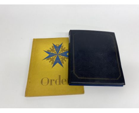 A German Orden paperback cigarette card album with cards and a folder of The Victoria Cross and George Cross Memorial Appeal 