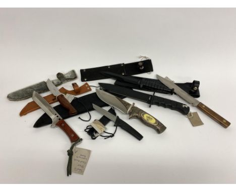 Seven various hunting knives, to include a Maxam camp knife with inlaid grip, another with imitation seal skin sheath and a f
