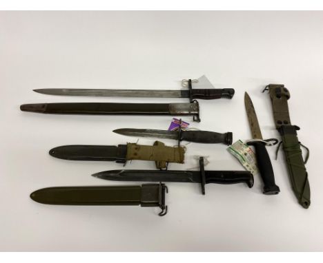 Two USA M7 knife bayonets, Vietnam Era, a Remington/Enfield 1918 bayonet and a Springfield M1942 knife bayonet