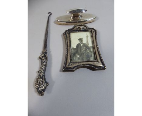 A Silver Mounted Button hook, Silver Mounted Photo Frame and Silver Mounted Nail Buffer 