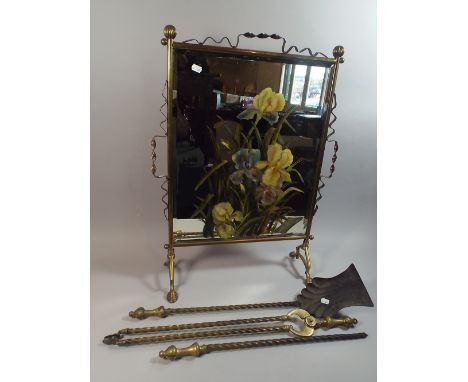 A Victorian Brass Framed Mirrored Fire Screen with Painted Floral Decoration together with Three Long Handled Fire Irons