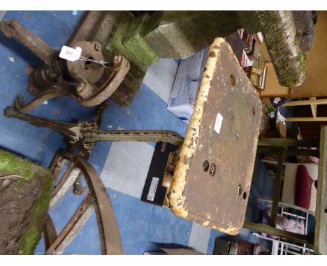 A Cast Iron Tripod Stand with Claw Feet