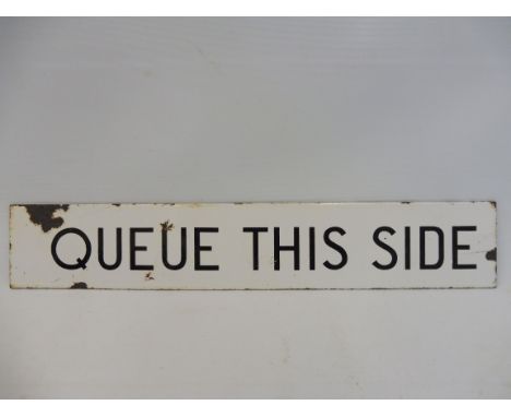 A narrow enamel sign bearing the words 'Queue This Side', possibly railway or bus related, 15 x 2 3/4".