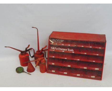 An SFK &amp; Dormer Tools dispensing cabinet display case, 14 3/4" wide plus five oil cans. 