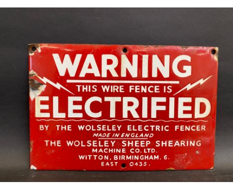 A Warning 'Electrified wire fence' by the Wolseley Electric Fences small enamel sign, 9 x 6".