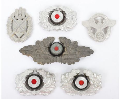Selection of Third Reich Cap Insignias, including three army peaked cap wreaths with central cockade, zinc NSDAP political le