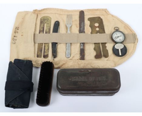 Grouping of Personal Effects of a WW1 British Soldier, consisting of a cloth kit roll with various items of personal effects 
