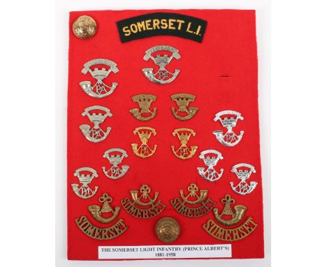 Board of Badges Relating to the Somerset Light Infantry, including various patterns of cap badge, shoulder titles, collar bad