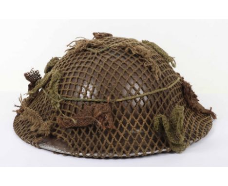 WW2 British Herefordshire Regiment Steel Combat Helmet with Camouflaged Net Cover, superb example of a WW2 British combat hel