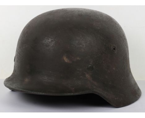German Army M-40 Pattern Steel Combat Helmet, rough textured finish to the exterior and interior of the shell. Helmet has bee