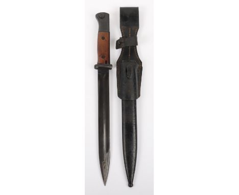 Matching Numbers WW2 German K98 Bayonet, with two piece wooden grips. Housed in its original steel scabbard which is numbered