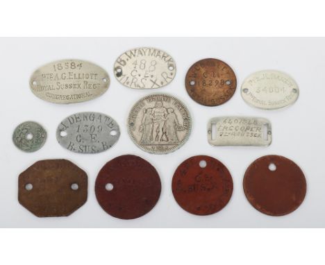 Grouping of Identity Discs of Royal Sussex Regiment Interest, consisting of sterling silver example engraved “PTE R BAKER 340