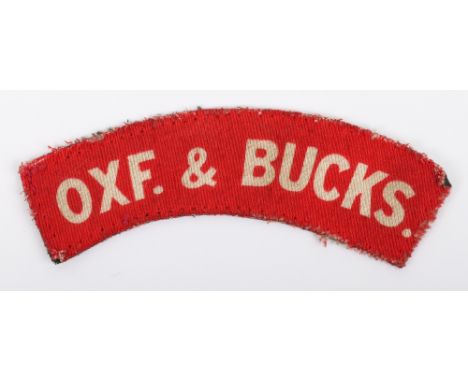 Scarce WW2 Ox &amp; Bucks Light Infantry Printed Shoulder Title, white lettering on red backing. Uniform removed example. 