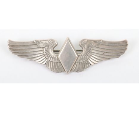 Scarce American Women’s Army Service Pilots Wing, fine example in sterling silver with brooch pin fitting to the reverse. Ex 