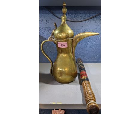 A police truncheon and an early 20th century brass jug, possibly from Turkey, the truncheon decorated with a crown, marked M.