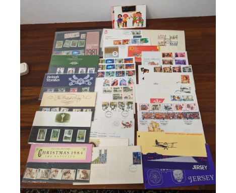 A collection of mainly mint postage stamps and first day covers to include 'Christmas 1984', 'British Textiles 1981 collector