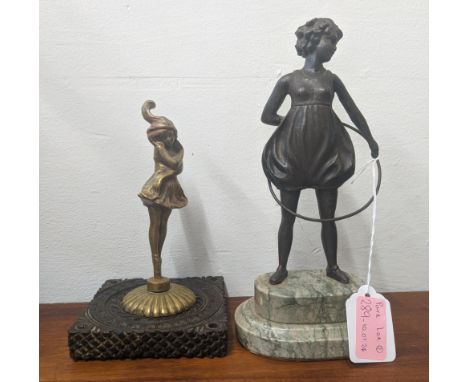 Two figures of a ballerina and an ant dew style figurine of a young girl playing with a hula hoopLocation:If there is no cond