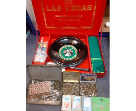 A small quantity of vintage toys to include a Las Vegas roulette set and vintage Meccano small accessories 