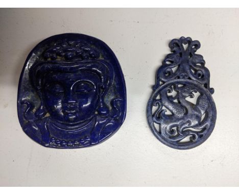 An Oriental carved lapis lazuli stone boulder, carved with a depiction of Buddha's head in relief, along with a carved and pi