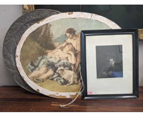 An etching of Rembrandt, and a large oval print unframed of a traditional scene and a large circular charger. 
