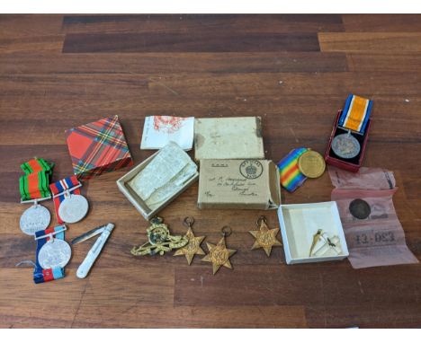 World War I and II medals awarded to K Haydock and 102496 PTE RC Haydock R.A.M.C, a cap badge, a silver fruit knife, a cross,