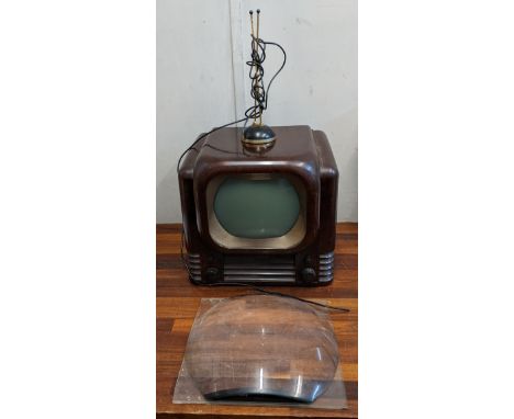 A circa 1950s Bush TV 22 Bakelite television can be used to watch DVDs with a converter along with a magnifier and vintage ae