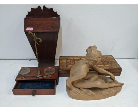 A pair of dispensing scales with a drawer to the base along with a mahogany candle box, a games box inlaid with a cribbage bo