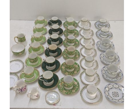 A variety of coffee cans and saucers to include Minton, Limoges, Spode, Coalport and others, together with two Royal Crown De