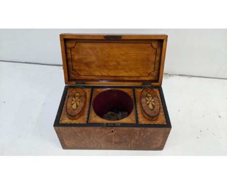 An early 19th century mixed veneered tea caddy with marquetry ornamentsLocation:If there is no condition report shown, please