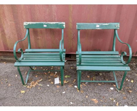 Two vintage green painted wrought iron slatted garden chairs Location:If there is no condition report shown, please request 
