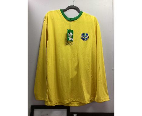 Pele Autograph, black marker signed (unverified) on a yellow Brazil retro shirt.