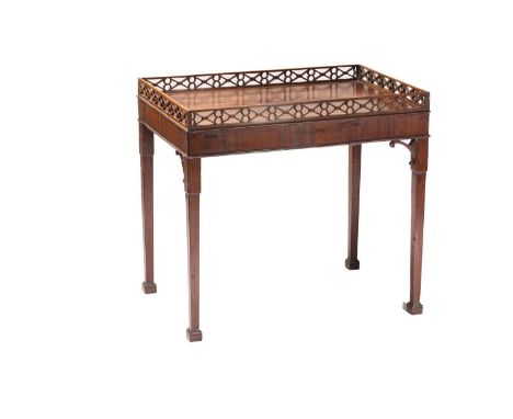 A George III and later rectangular mahogany silver table, possibly Irish, with a pseudo-Oriental pierced gallery above a cros