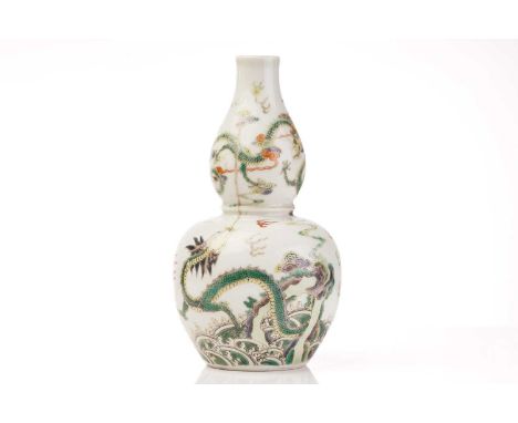 A Chinese porcelain famille verte dragon vase, of double gourd form, painted with two dragons writhing amongst clouds, the lo