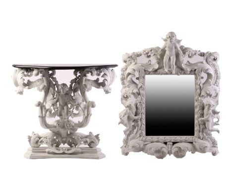 An impressive white-painted and carved composition Baroque console table and wall mirror with a profusion of winged putto and