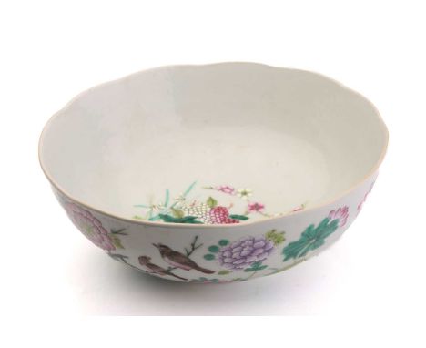 A Chinese porcelain bowl famille bowl, with scalloped rim, painted with birds amongst lotus flowers and pods, chrysanthemums 