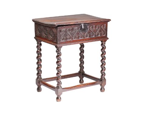 A late 17th-century oak rectangular Bible box on later turned "Barley Twist" box frame base; the box with a hinged lid and pl