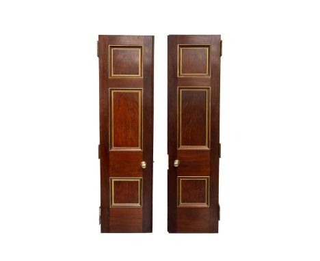 A pair of decorative Edwardian architectural three-panel mahogany and parcel gilt library doors fitted six heavy-duty brass "