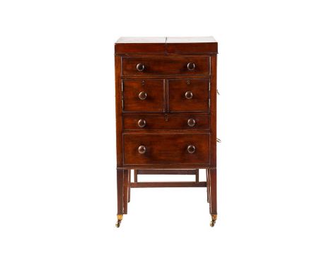 An early 19th century mahogany wash stand, the twin flap top enclosing a retractable mirror, over dummy drawers, a pair of cu