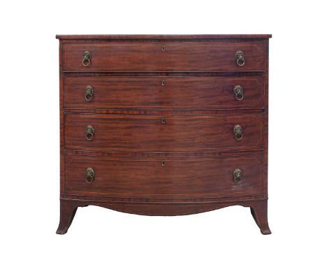 An early 19th century mahogany and boxwood lined bowfront chest of drawers, the four long graduated drawers with lion mask ha