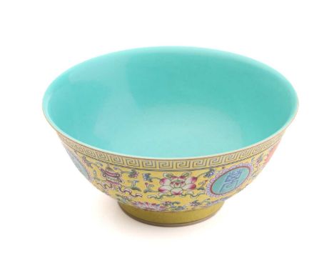 A Chinese porcelain ten thousand blessings bowl, painted with Buddhist symbols on a yellow ground, between leiwen and petal b