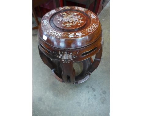 A Chinese hardwood and mother of pearl inlaid barrel shaped stool 