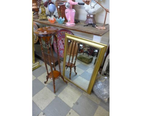 A mahogany barleytwist jardiniere stand and a gilt framed mirror 