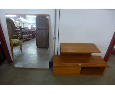 Two teak wall shelves and a teak framed mirror 
