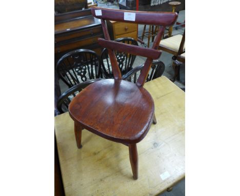 A painted Ercol elm and beech child's chair 