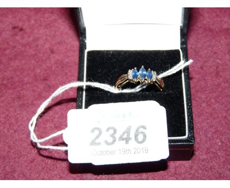 A 375 9ct Gold Ring with 3 blue stones and chipped diamonds (boxed)