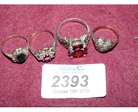 Three 9ct gold/silver dress Rings and a silver Ring