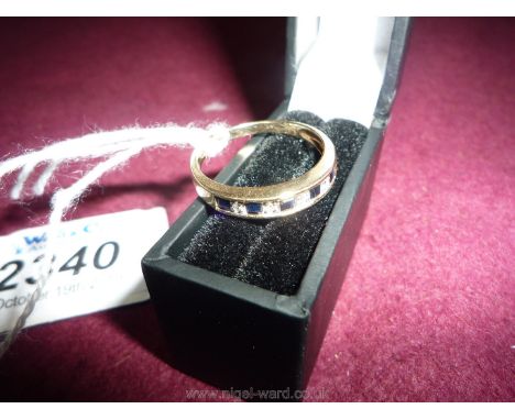 A 9 ct. sapphire and diamond eternity Ring, size O, hallmarked.