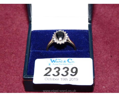 A 9 ct. sapphire and diamond Ring, size p, hallmarked.