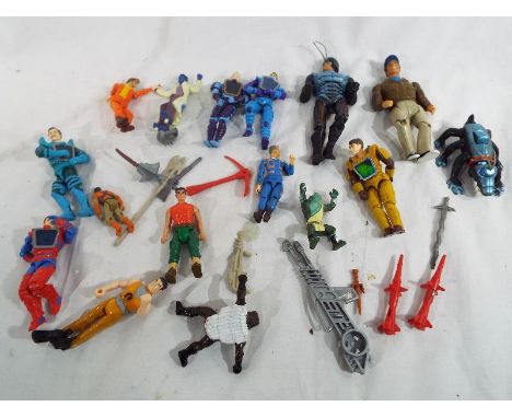 A collection of various action figures to include the A -Team, Action Man and other
